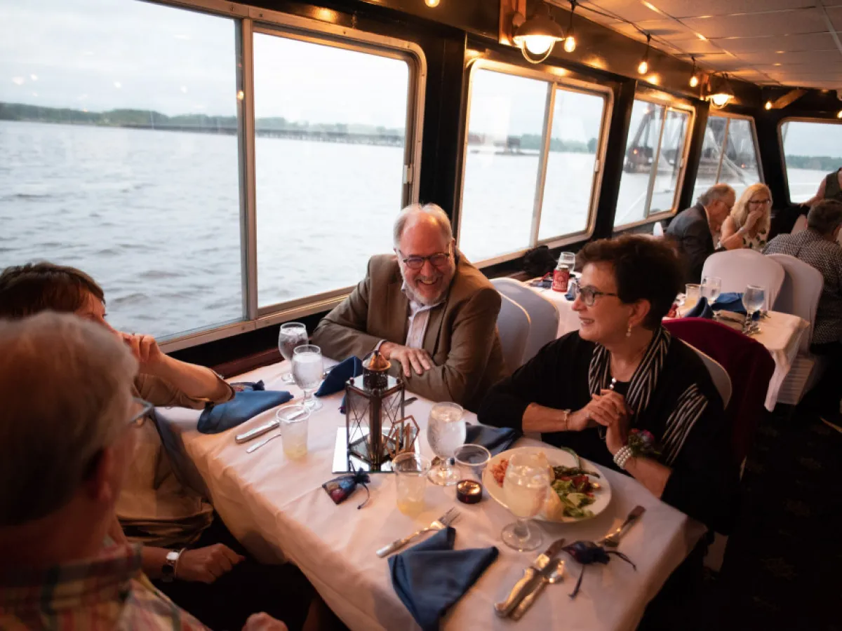 a group of people sitting at a table