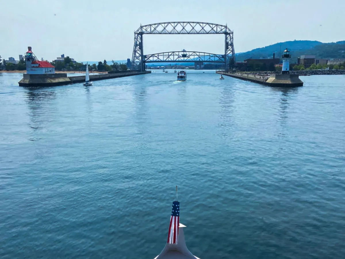 a boat is docked next to a body of water
