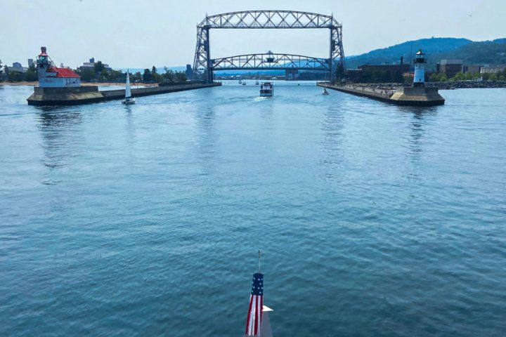 a boat is docked next to a body of water