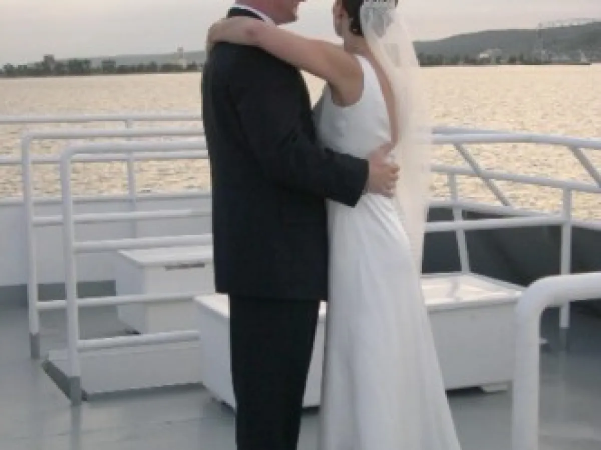 a person standing next to a body of water