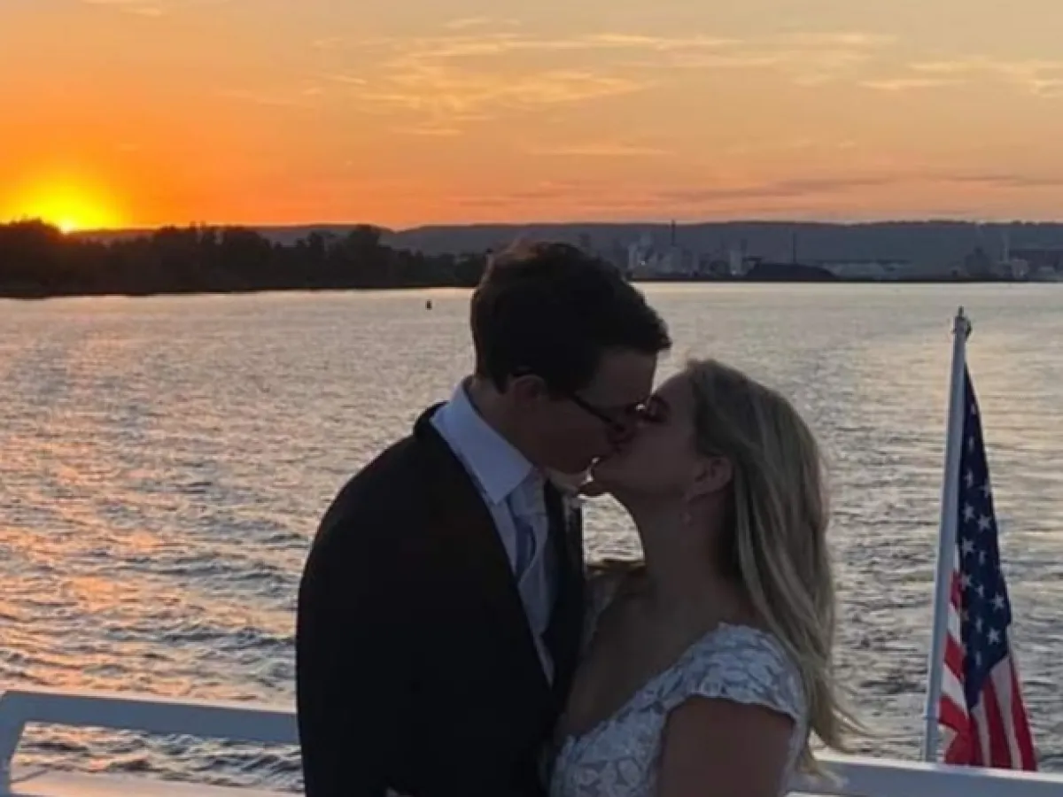 a person sitting in front of a body of water
