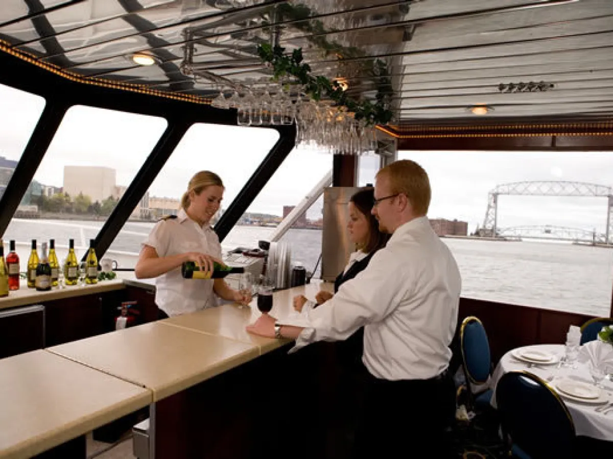 a group of people preparing food in a kitchen