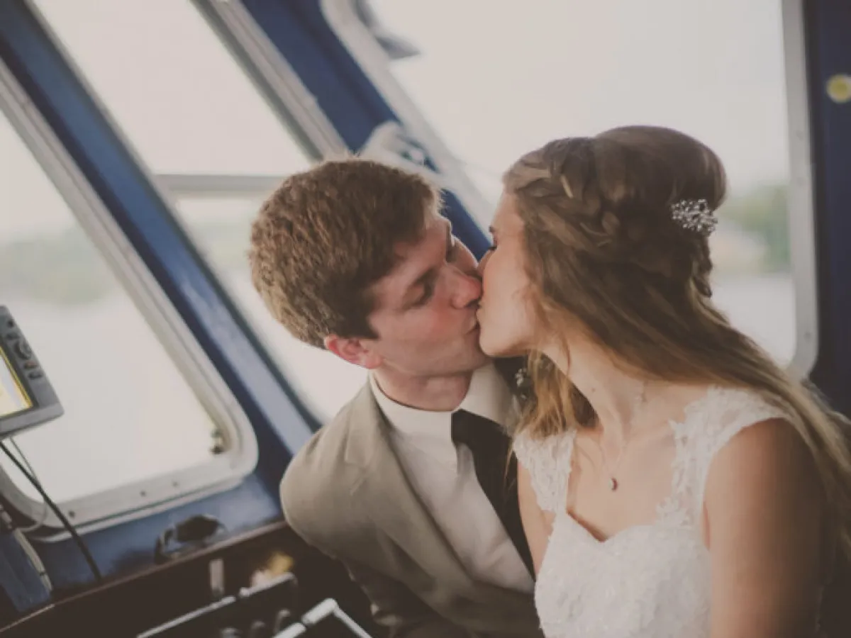 a person cutting a cake