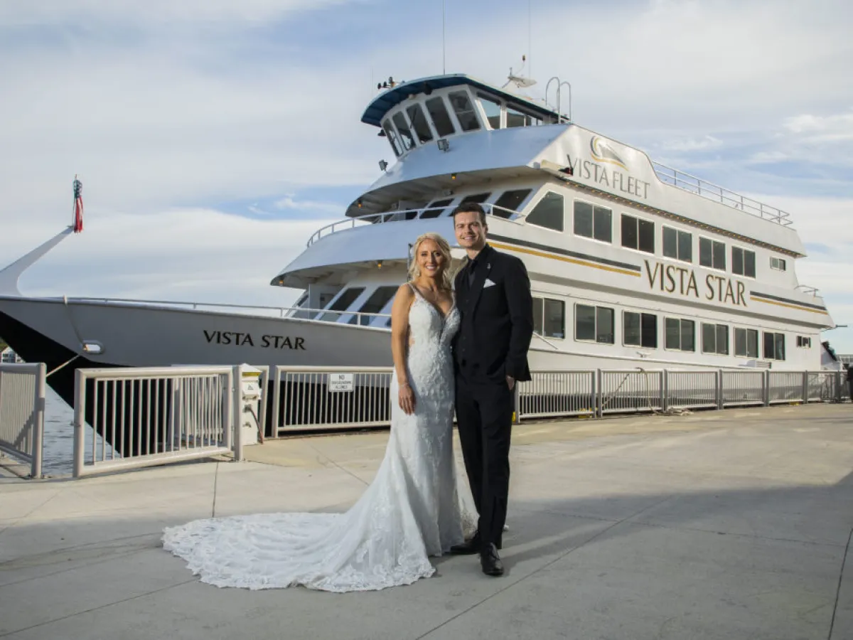 a man and a woman standing in front of a building