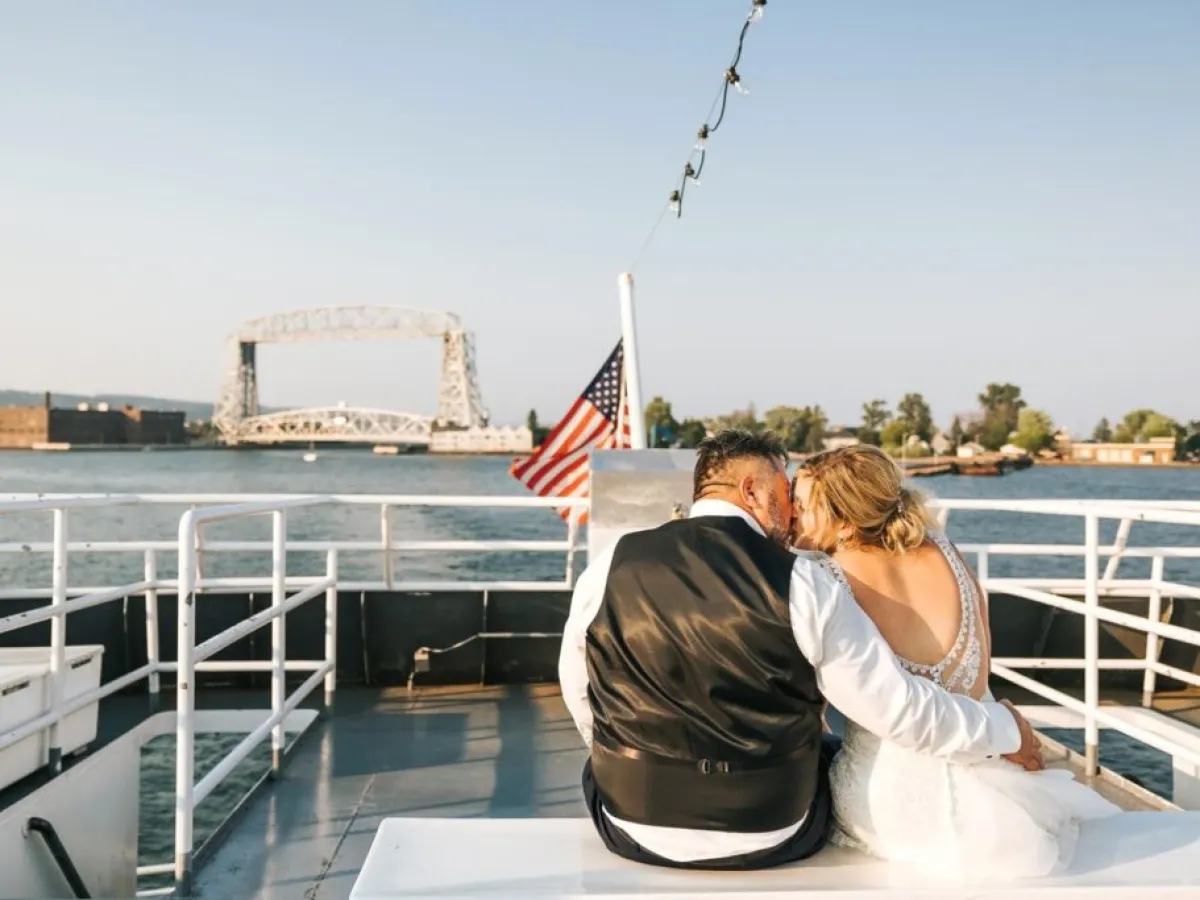 a person standing in front of a bridge