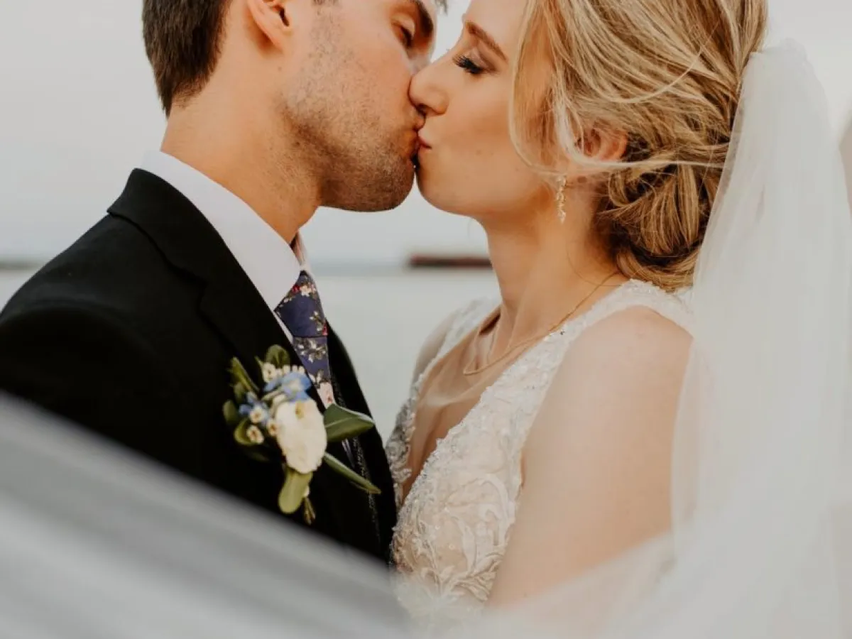 a man and a woman looking at the camera