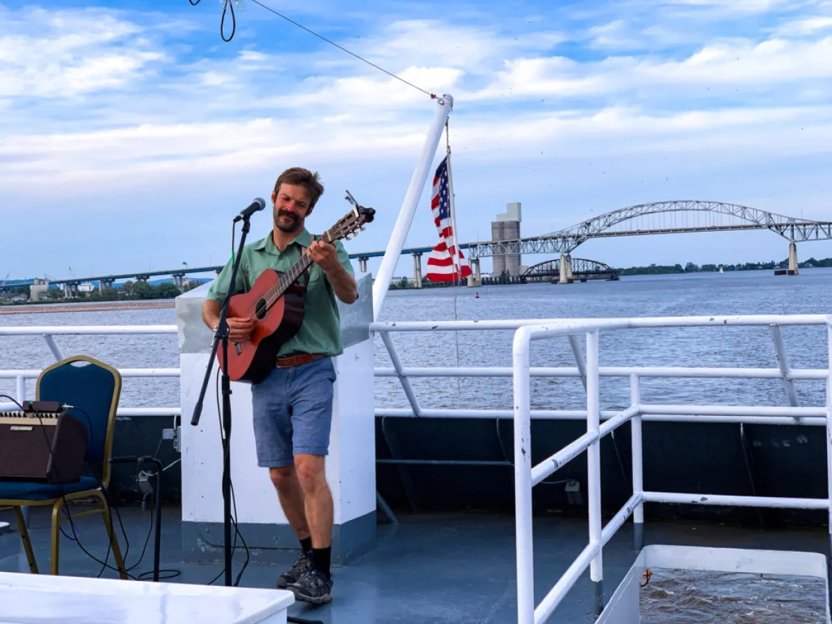 a man standing in front of a pier