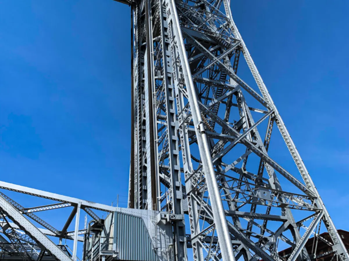 a train crossing a bridge over a body of water