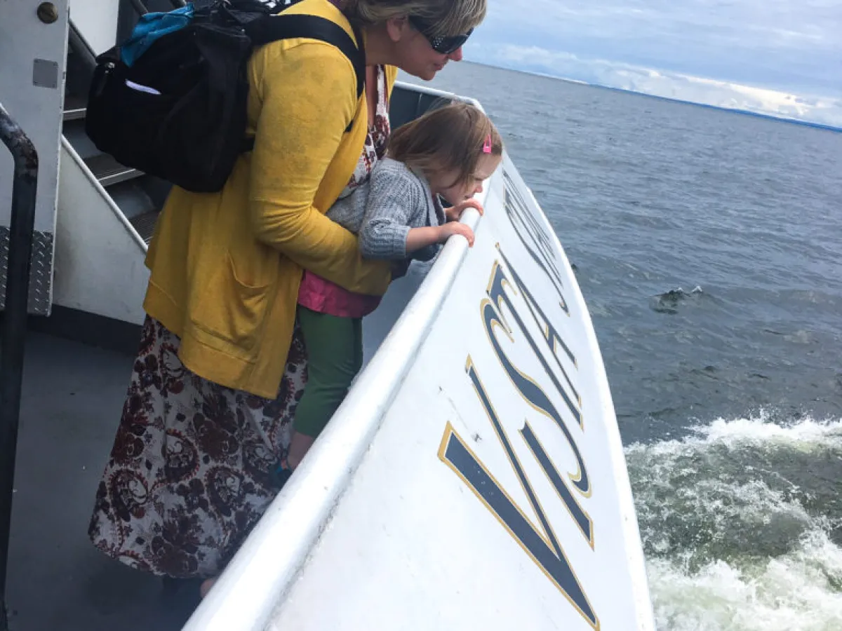 a person standing on a boat in the water