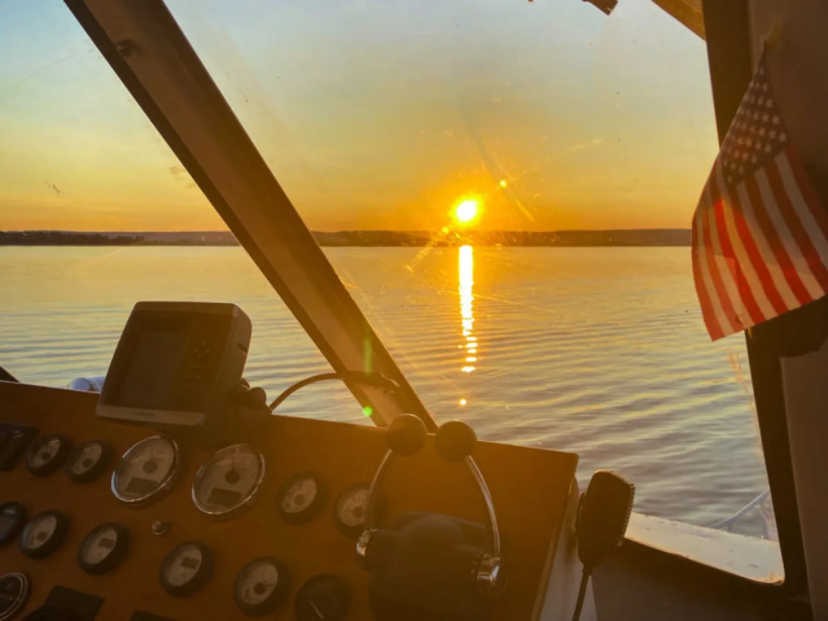 a boat sitting next to a body of water