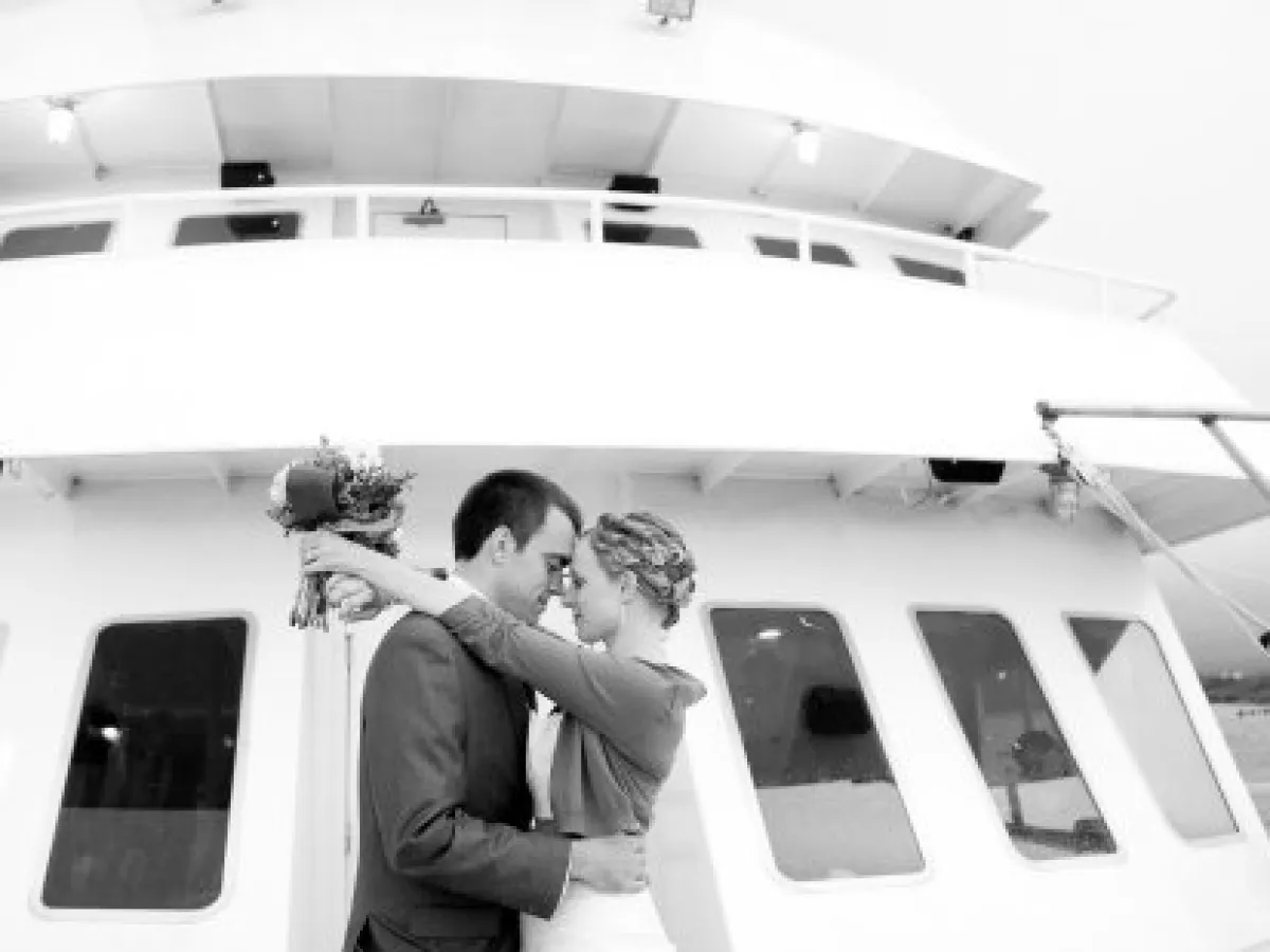 a man standing in front of a car posing for the camera
