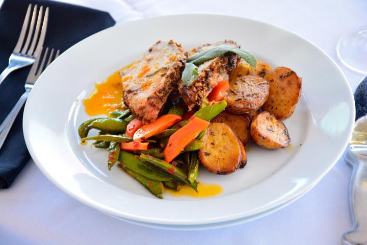 a plate of food with meat and vegetables