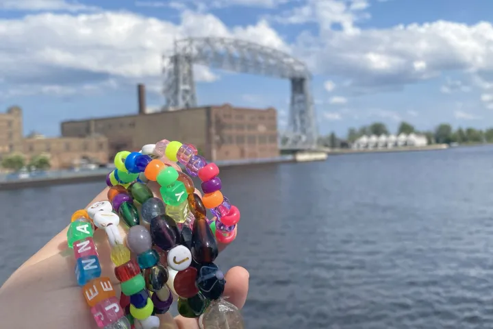 kid bracelets in front of the Duluth Aerial Lift Bridge
