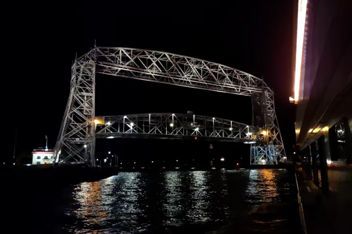 a large bridge lit up at night