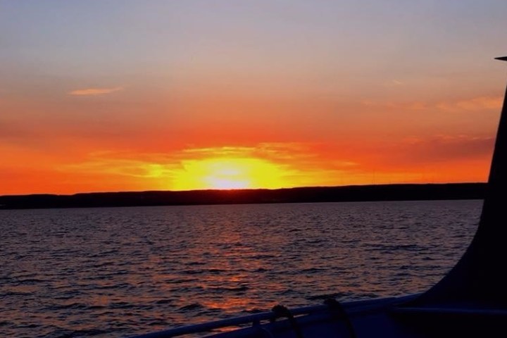 a sunset over a body of water